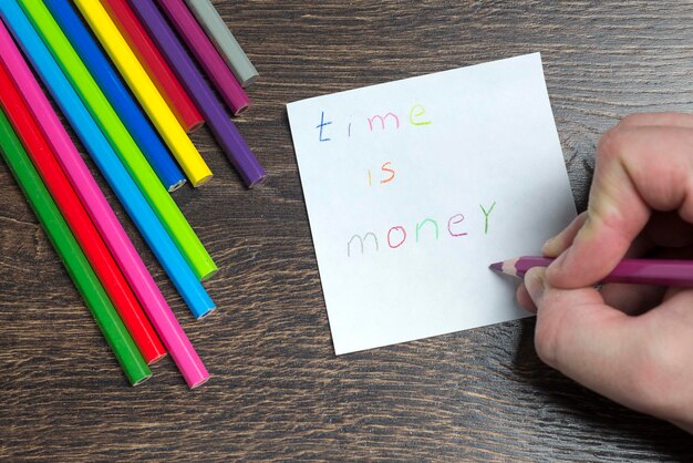 A close-up shot of a young girl drawing with colored pencils at a table, showcasing a typical childhood activity that the Child Tax Credit can help support.