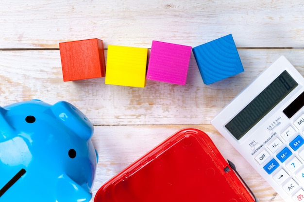 A close-up of a calculator with colorful blocks representing children, symbolizing the financial calculation and impact of the Child Tax Credit.