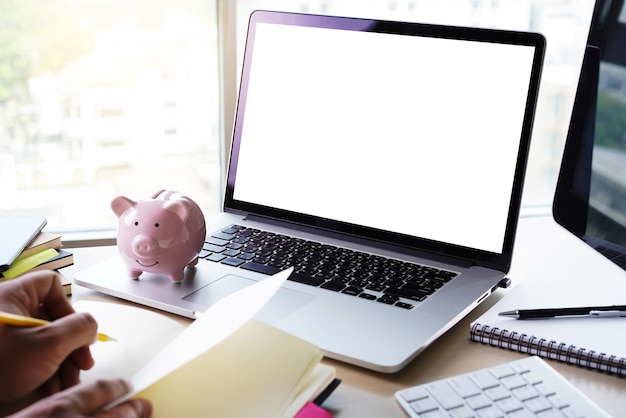 A laptop displaying a page for adjusting 401(k) contributions online.